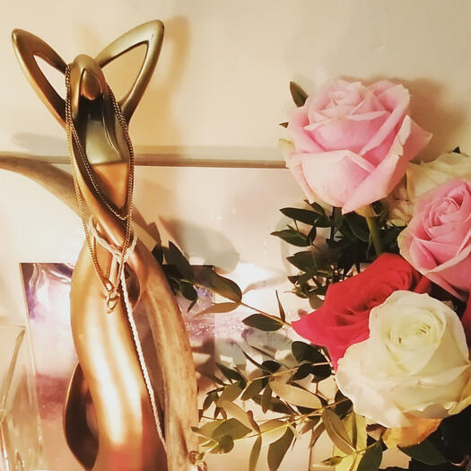 Icons of Pleasure - fresh roses and a golden goddess statue on my Freya altar