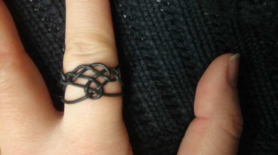 Crafting subtle spells - a ring on my finger made of leather cord and a pretty knot